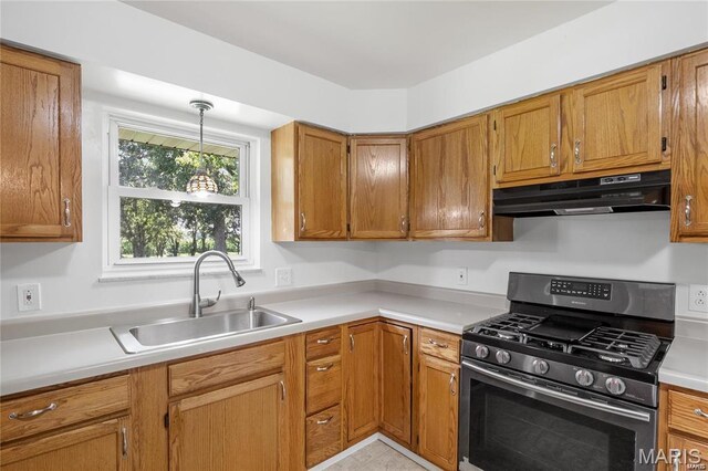 9506 B Rd, Valmeyer, IL 62295 - kitchen with gas range, under cabinet range hood, a sink, and light countertops