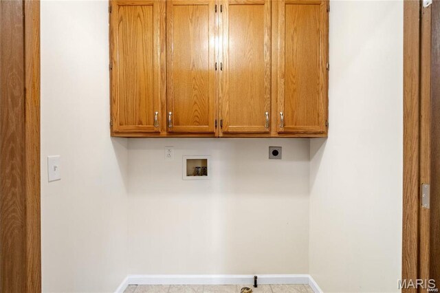 9506 B Rd, Valmeyer, IL 62295 - laundry area featuring cabinet space, washer hookup, baseboards, and electric dryer hookup
