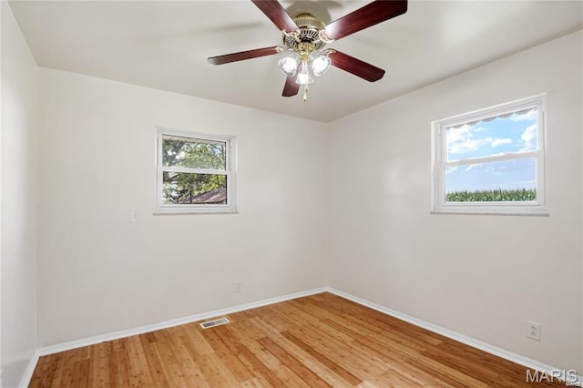 9506 B Rd, Valmeyer, IL 62295 - spare room featuring baseboards, light wood finished floors, and ceiling fan