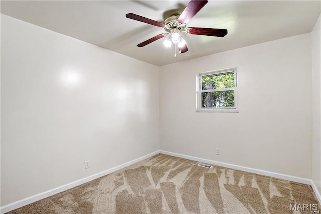 9506 B Rd, Valmeyer, IL 62295 - spare room featuring baseboards, carpet, and a ceiling fan