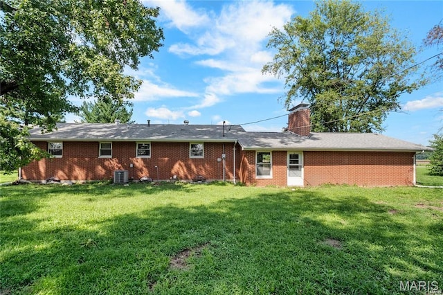 9506 B Rd, Valmeyer, IL 62295 - rear view of house with a lawn, central AC unit, brick siding, and a chimney