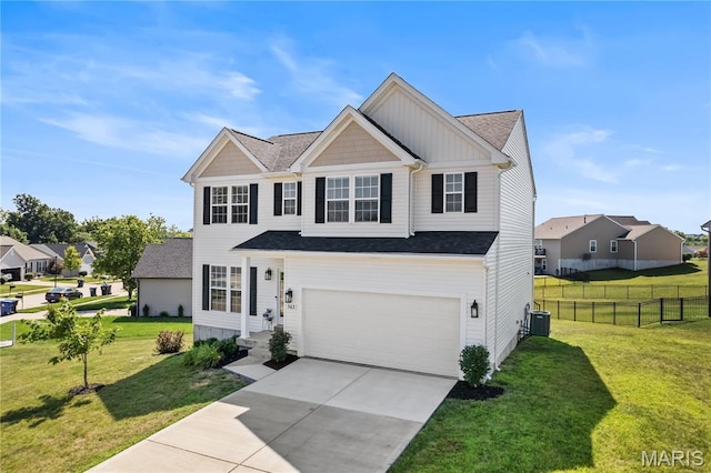 563 Crystal Stream Dr, Wentzville, MO 63385 - view of front facade featuring an attached garage, driveway, roof with shingles, board and batten siding, and a residential view