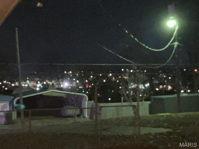 view of yard at twilight