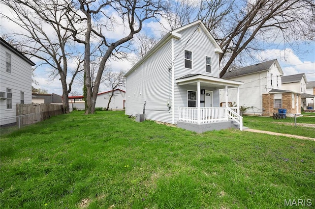 rear view of property with covered porch