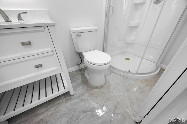 bathroom featuring marble finish floors, baseboards, a stall shower, and toilet