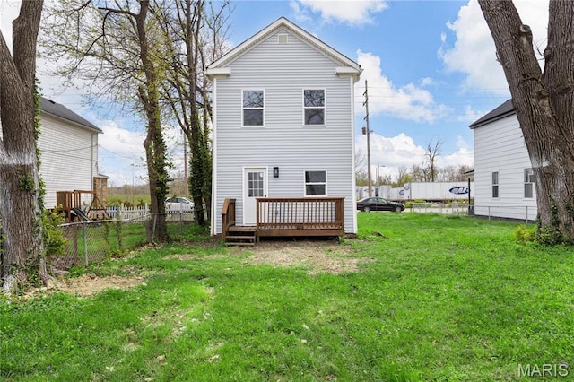 rear view of house featuring a wooden deck