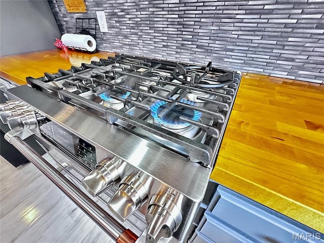 127 Kehner Rd, Steelville, MO 65565 - kitchen view of stainless steel gas range oven and wood finished floors