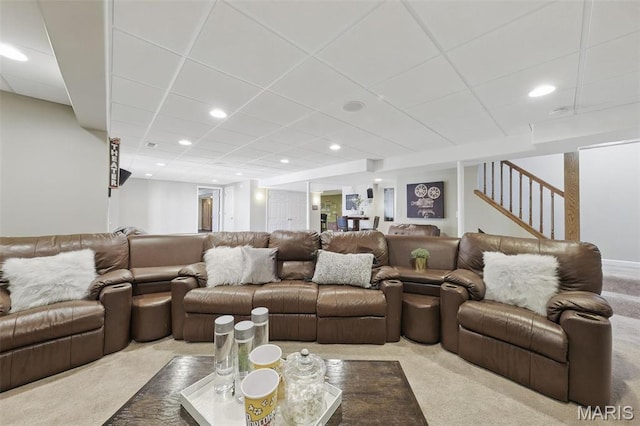 living room featuring carpet, a paneled ceiling, recessed lighting, and stairway