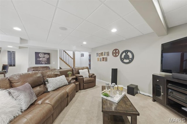 living room featuring light carpet, stairway, baseboards, recessed lighting, and a paneled ceiling