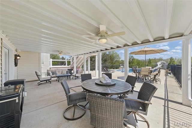 view of patio featuring outdoor dining space, outdoor lounge area, and a ceiling fan