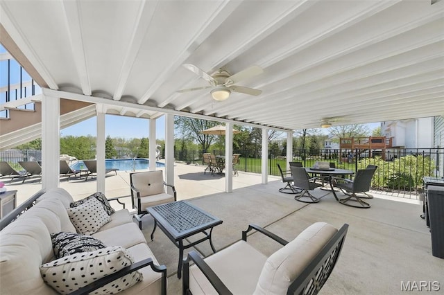 view of patio featuring an outdoor living space, outdoor dining area, a fenced backyard, and a ceiling fan
