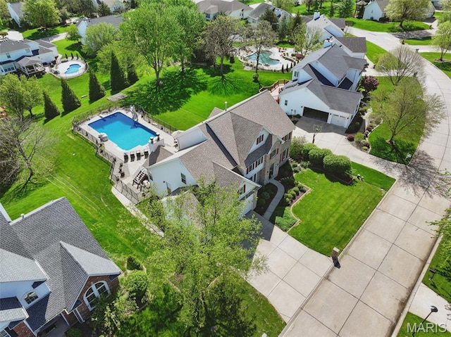aerial view of residential area with a pool area