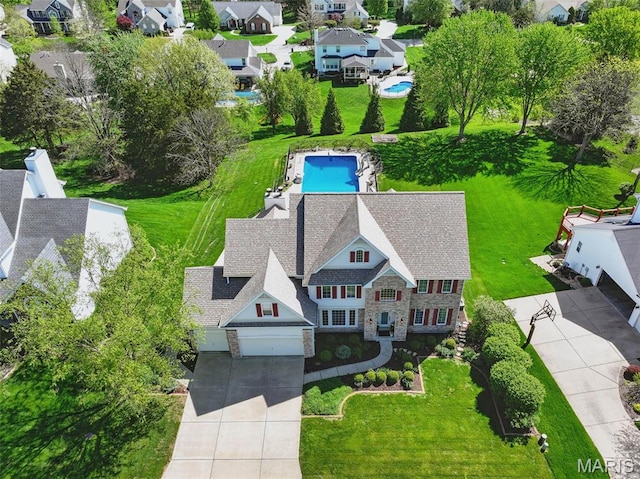 aerial perspective of suburban area with a pool