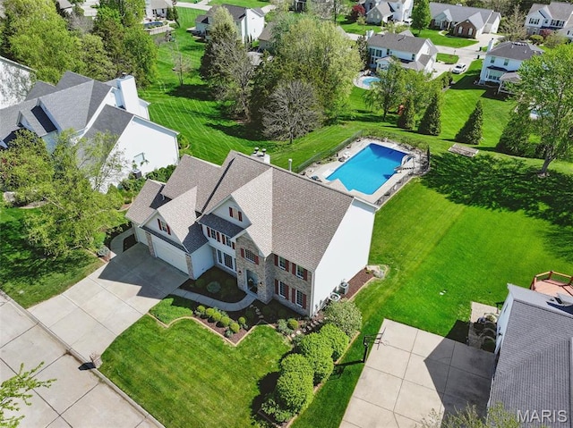 aerial perspective of suburban area with a pool area