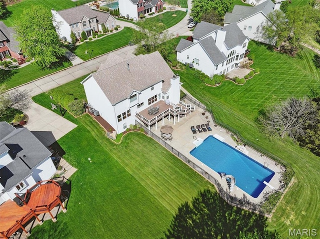 aerial view of residential area featuring a pool