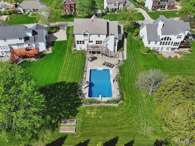 aerial view of residential area with a pool