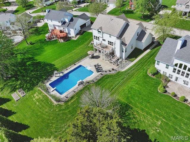aerial perspective of suburban area featuring a pool area