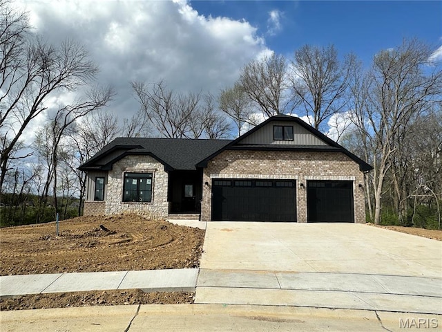 632 Glendale Dr, Troy, IL 62294 - modern farmhouse with a garage, concrete driveway, brick siding, and stone siding