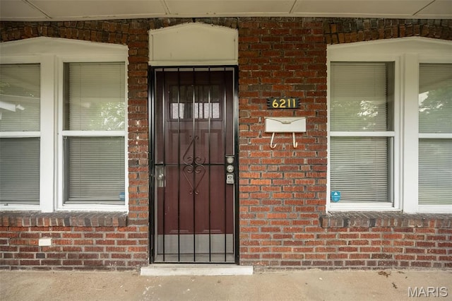 6211 Idaho Ave, Saint Louis, MO 63111 - view of exterior entry featuring brick siding