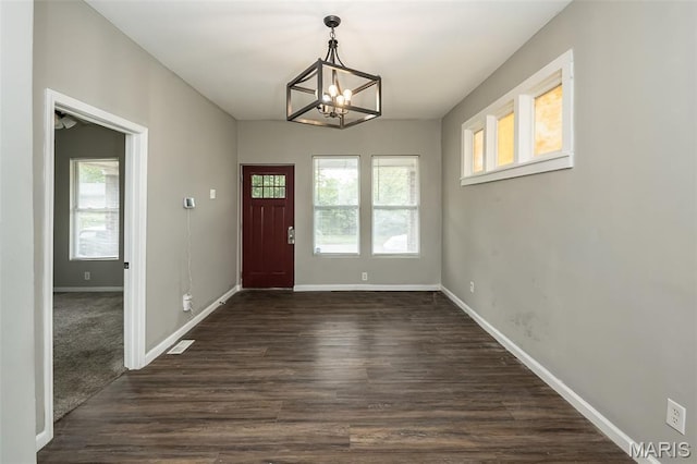 6211 Idaho Ave, Saint Louis, MO 63111 - entrance foyer with a chandelier, baseboards, and dark wood-style flooring