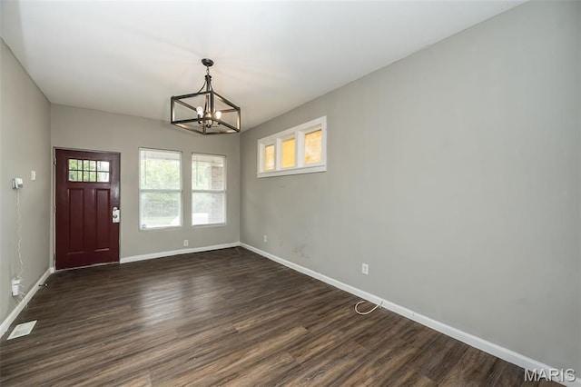 6211 Idaho Ave, Saint Louis, MO 63111 - unfurnished dining area featuring a chandelier, baseboards, and dark wood-style flooring