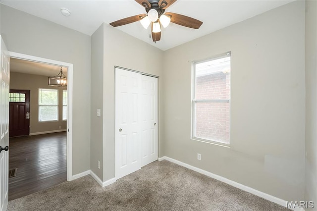 6211 Idaho Ave, Saint Louis, MO 63111 - unfurnished bedroom featuring baseboards, a closet, carpet, a ceiling fan, and a chandelier