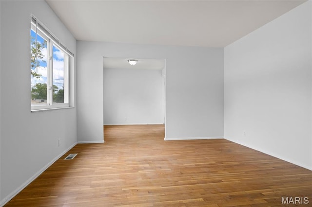1455 Burnside Ct, Florissant, MO 63031 - unfurnished room with light wood-style flooring and baseboards