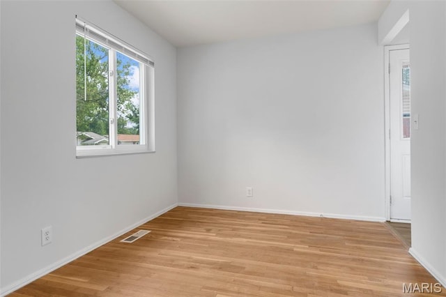 1455 Burnside Ct, Florissant, MO 63031 - unfurnished room with light wood-style flooring and baseboards