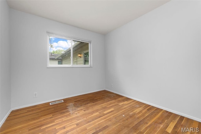 1455 Burnside Ct, Florissant, MO 63031 - unfurnished room featuring light wood-style flooring and baseboards