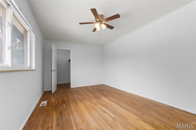 1455 Burnside Ct, Florissant, MO 63031 - spare room with ceiling fan, wood finished floors, and baseboards