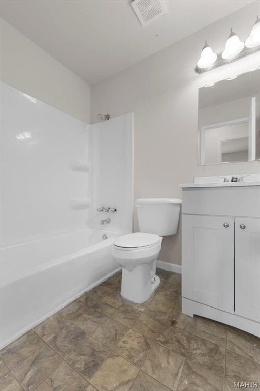 1455 Burnside Ct, Florissant, MO 63031 - bathroom featuring vanity, toilet, washtub / shower combination, and baseboards