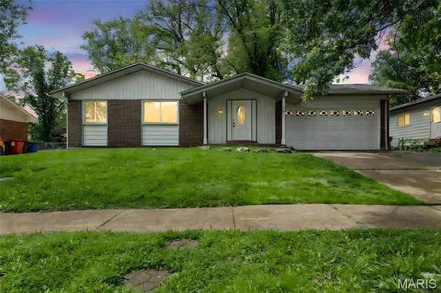 1455 Burnside Ct, Florissant, MO 63031 - ranch-style house featuring driveway, a garage, a lawn, and brick siding