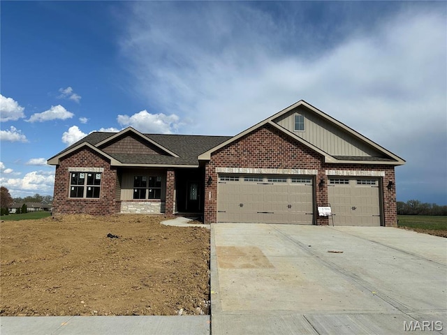 624 Glendale Dr, Troy, IL 62294 - craftsman inspired home featuring a garage, board and batten siding, brick siding, concrete driveway, and roof with shingles