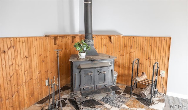 11 Saint Ann Ave, St James, MO 65559 - detailed view of a wood stove, wood walls, and wainscoting