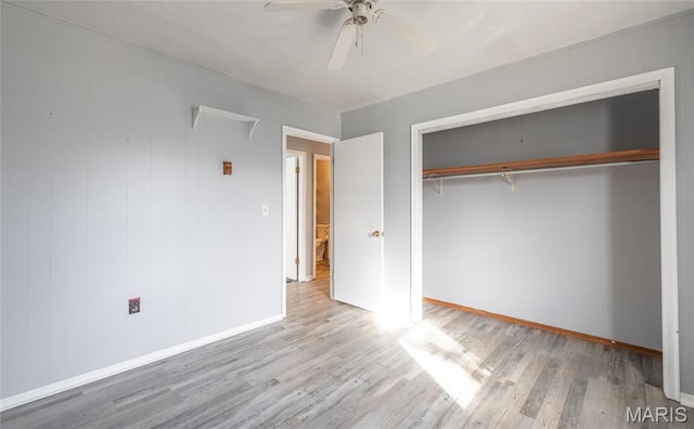 11 Saint Ann Ave, St James, MO 65559 - unfurnished bedroom with wood finished floors, baseboards, a closet, and a ceiling fan