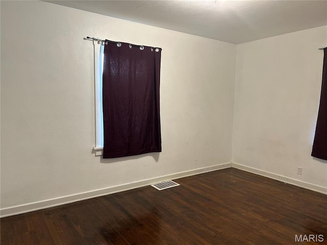127 Whitelaw Ave, East Alton, IL 62024 - unfurnished room with baseboards and wood finished floors