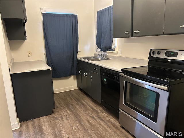 127 Whitelaw Ave, East Alton, IL 62024 - kitchen featuring electric range, black dishwasher, a sink, dark wood finished floors, and light countertops