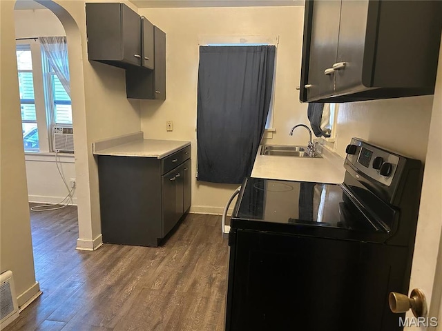 127 Whitelaw Ave, East Alton, IL 62024 - kitchen with electric range oven, a sink, baseboards, and light countertops