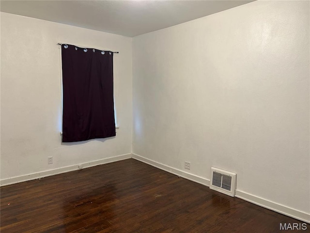 127 Whitelaw Ave, East Alton, IL 62024 - unfurnished room featuring dark wood-style floors and baseboards