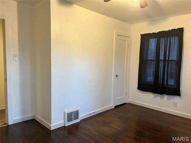 127 Whitelaw Ave, East Alton, IL 62024 - empty room with a ceiling fan, dark wood-style flooring, and baseboards