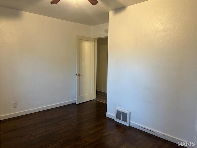 127 Whitelaw Ave, East Alton, IL 62024 - unfurnished room with ceiling fan, dark wood-type flooring, and baseboards