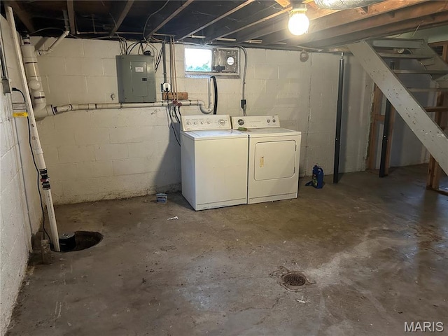 127 Whitelaw Ave, East Alton, IL 62024 - below grade area featuring electric panel, washing machine and clothes dryer, and stairway