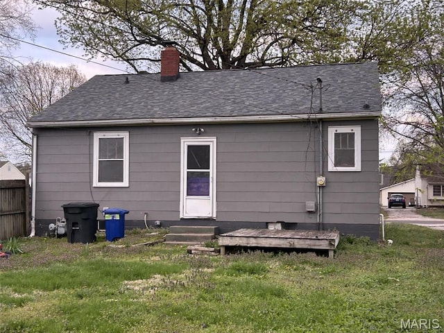127 Whitelaw Ave, East Alton, IL 62024 - back of house featuring a chimney, entry steps, and roof with shingles