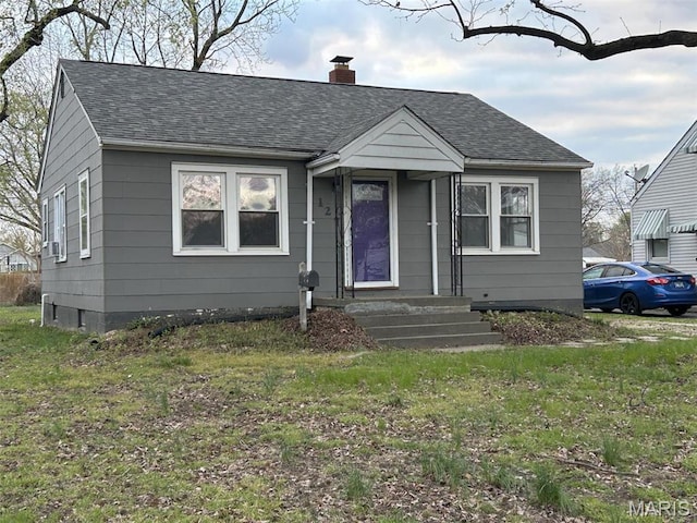 127 Whitelaw Ave, East Alton, IL 62024 - bungalow with a chimney, a shingled roof, and a front lawn