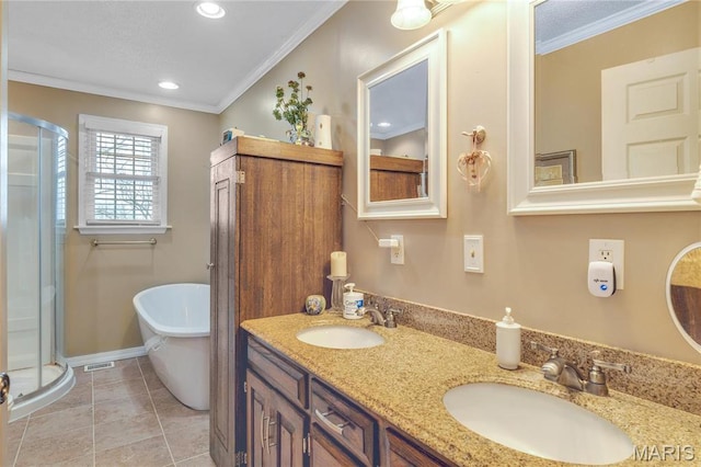 full bathroom featuring a shower stall, ornamental molding, a freestanding bath, double vanity, and recessed lighting