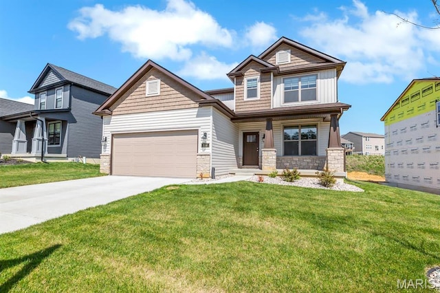 536 Edison Way, Wentzville, MO 63385 - craftsman-style house with stone siding, driveway, a front lawn, and covered porch