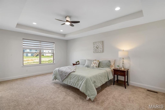 536 Edison Way, Wentzville, MO 63385 - bedroom featuring a tray ceiling, light colored carpet, baseboards, recessed lighting, and ceiling fan