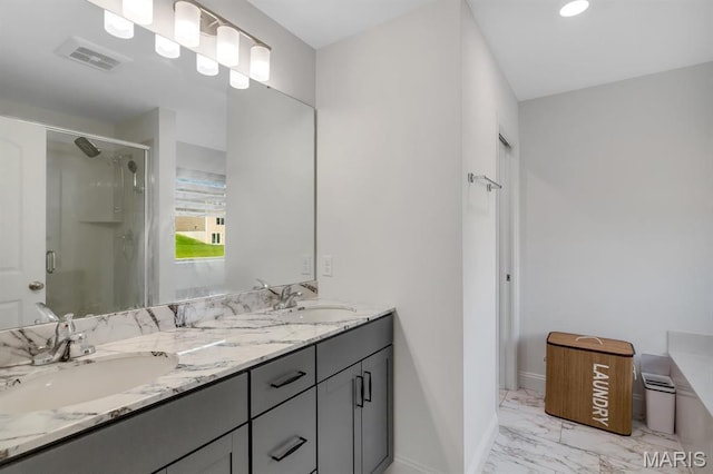 536 Edison Way, Wentzville, MO 63385 - bathroom featuring marble finish flooring, a shower stall, baseboards, and double vanity