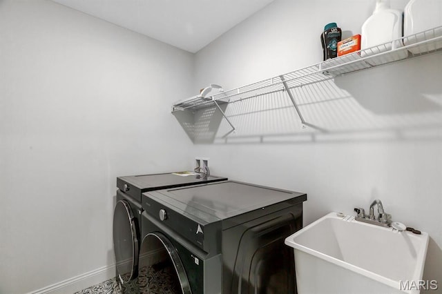 536 Edison Way, Wentzville, MO 63385 - clothes washing area with washer and clothes dryer and baseboards