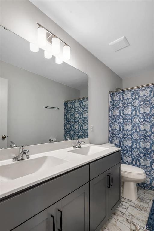 536 Edison Way, Wentzville, MO 63385 - full bath featuring double vanity, toilet, marble finish floors, and a shower with curtain